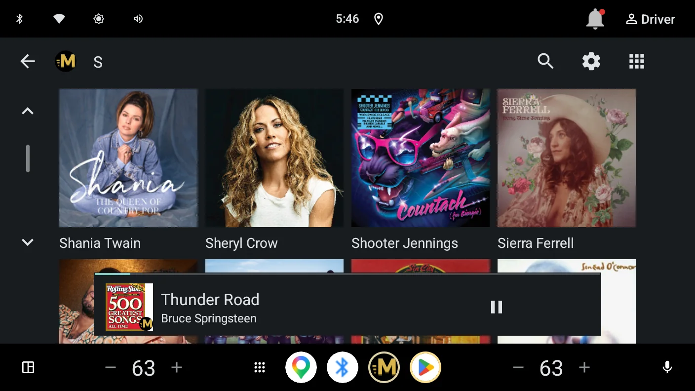 Browsing artists in the car: a grid of artist portraits with a track playing in the mini player